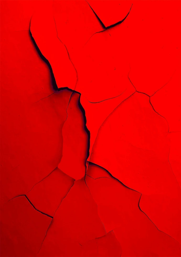 a red wall with a crack in it